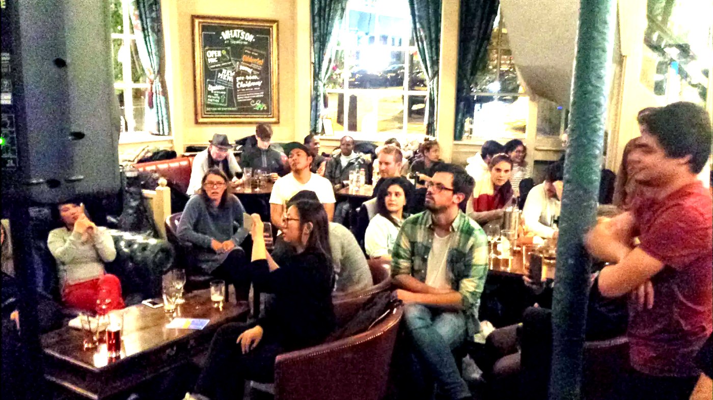 A pub audience enjoying an intimate live cover performance